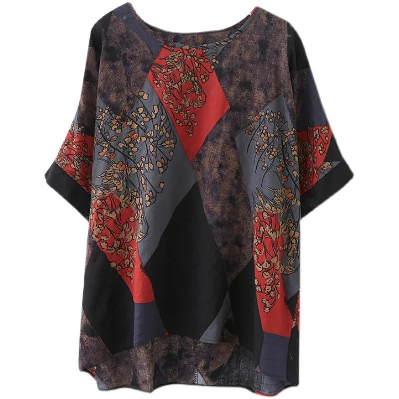Loose fit patchwork blouse with red floral and geometric patterns on black and gray background