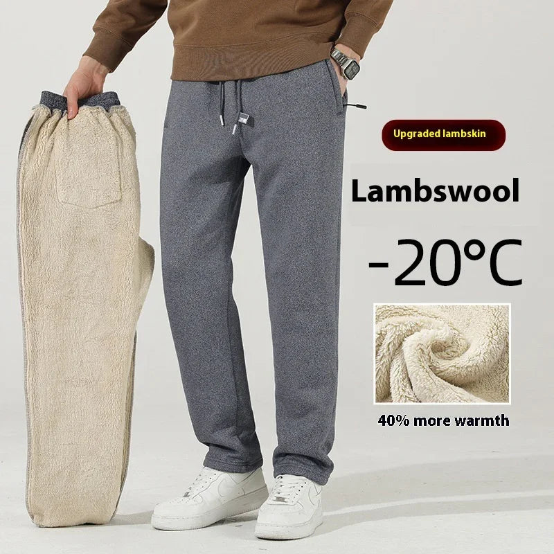 Person wearing gray lambswool pants holding matching warm fleece-lined pants, promoting -20°C warmth
