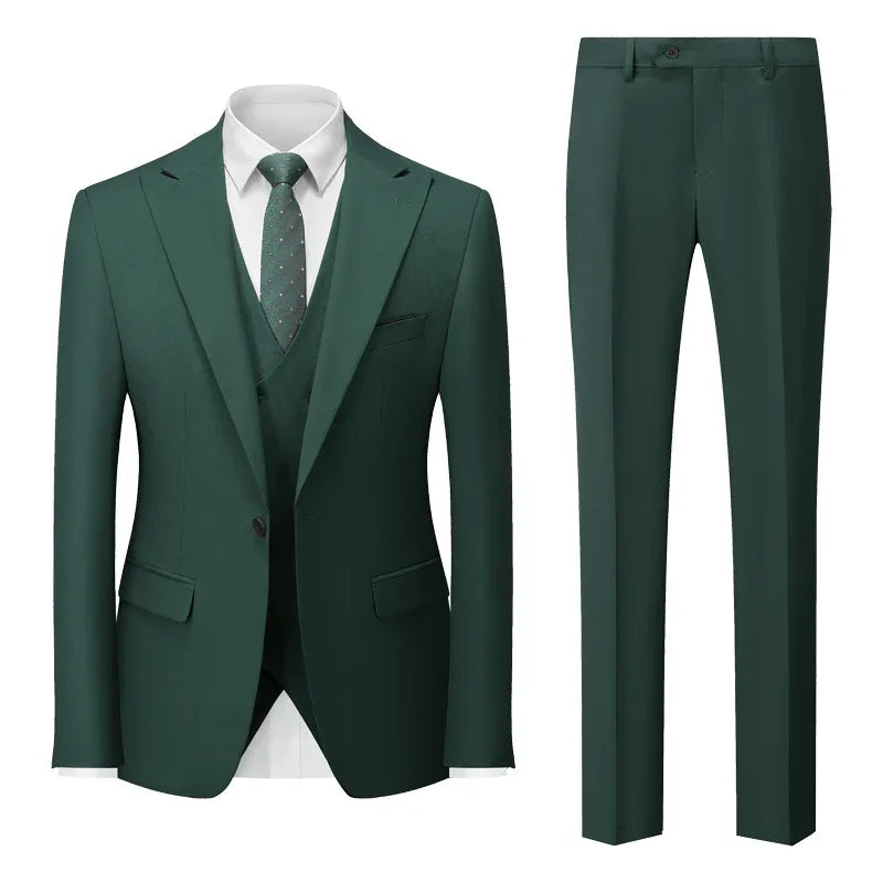 Elegant dark green three-piece men's suit with white shirt and patterned tie