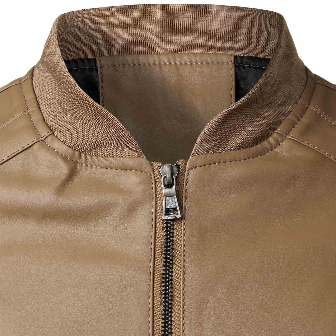 Close-up of brown leather jacket collar with ribbed knit trim and metal zipper