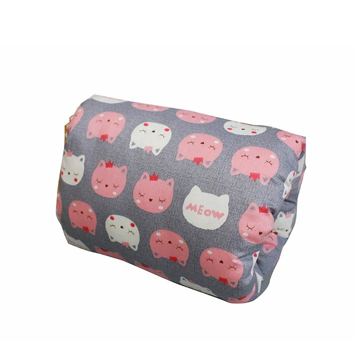 Gray fabric cushion featuring pink and white cat faces with crowns and the word 'MEOW' pattern