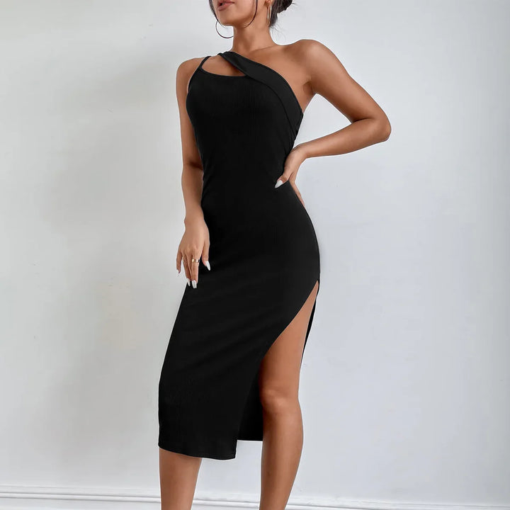 Woman wearing a black one-shoulder midi dress with side slit posing against light gray background