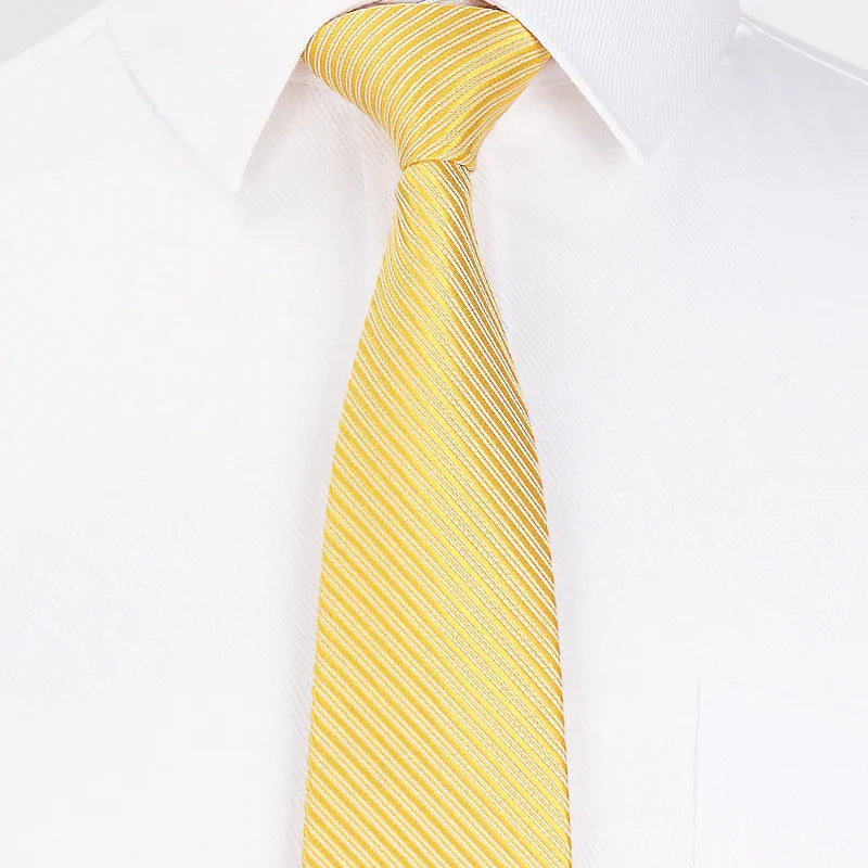 Yellow striped silk tie on white dress shirt with classic collar