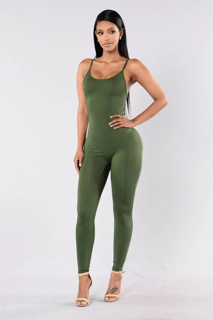 Woman modeling olive green sleeveless jumpsuit with spaghetti straps and heels