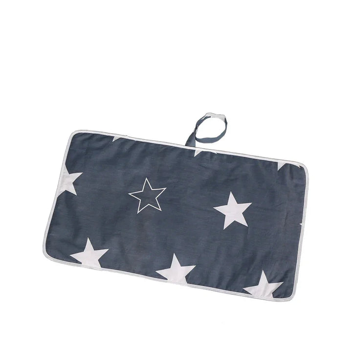 Rectangular folded dark blue fabric with white star patterns and a loop handle