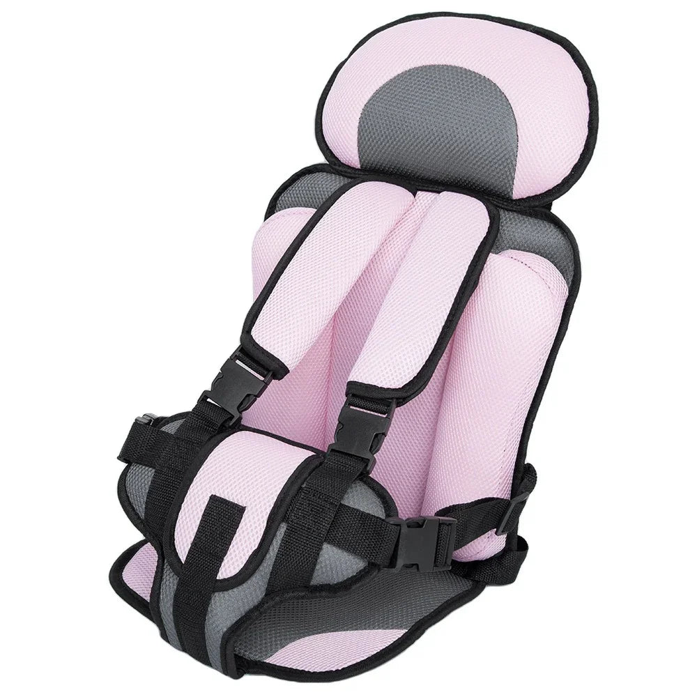 Pink and gray padded baby car seat insert with adjustable straps and buckles