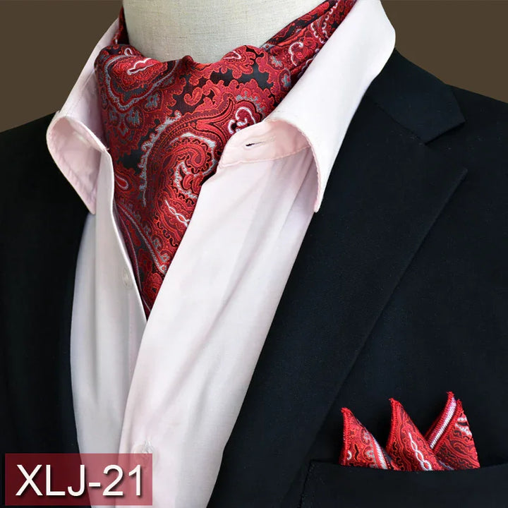 Red paisley silk cravat and matching pocket square worn with white shirt and black blazer
