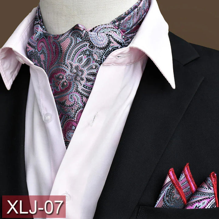 Elegant paisley ascot tie and matching pocket square paired with a light pink dress shirt and black blazer