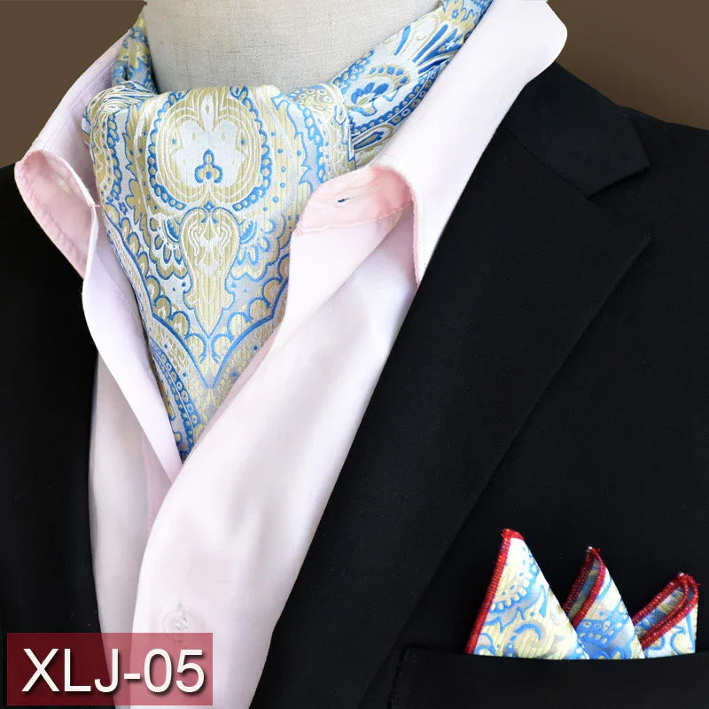 Elegant blue and beige paisley ascot and matching pocket square paired with light pink dress shirt and black blazer