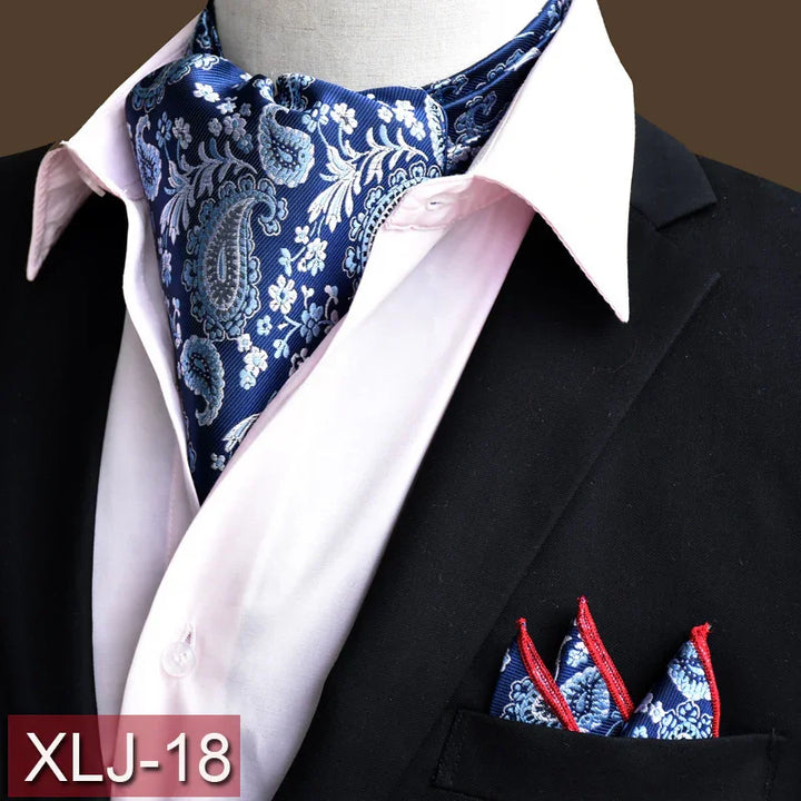 Blue paisley silk ascot and matching pocket square on white shirt and black blazer