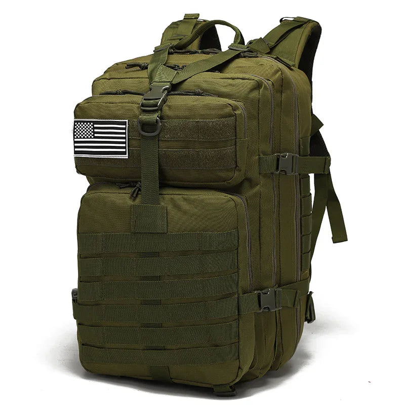 Olive green tactical backpack with multiple compartments and a black and white US flag patch