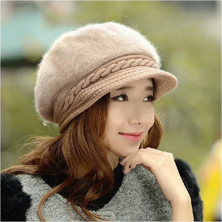 Young woman wearing a beige knitted beret with braided detail, posing outdoors in fall attire