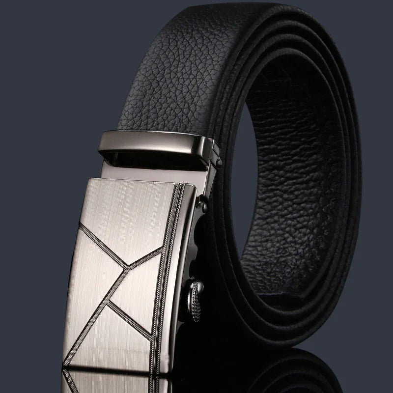 Black leather men's belt with a silver geometric patterned metal buckle on dark background