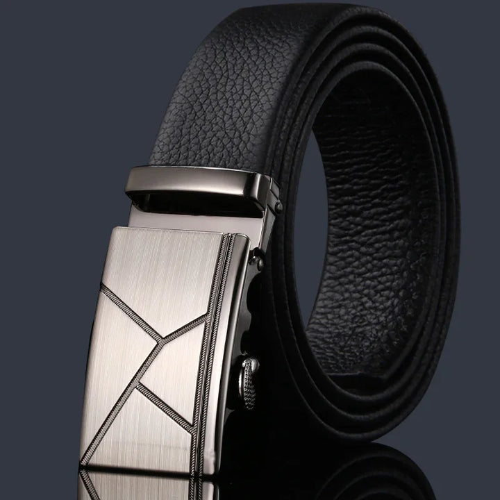 Black leather men's belt with a silver geometric patterned metal buckle on dark background