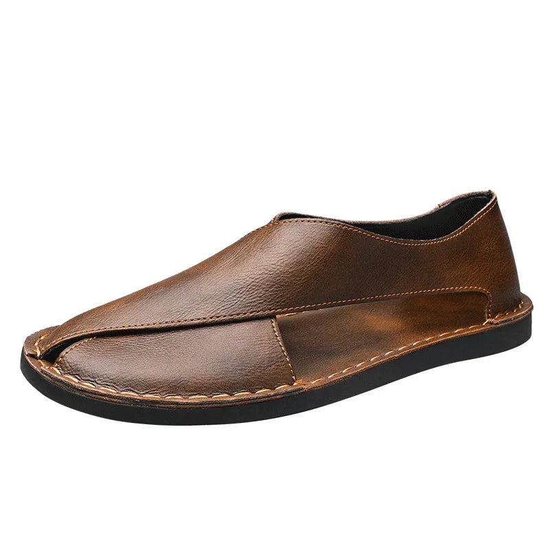 Brown leather slip-on shoe with black sole and stitched detailing, casual men’s footwear