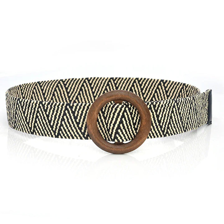 Black and beige woven belt with geometric zigzag pattern and round wooden buckle
