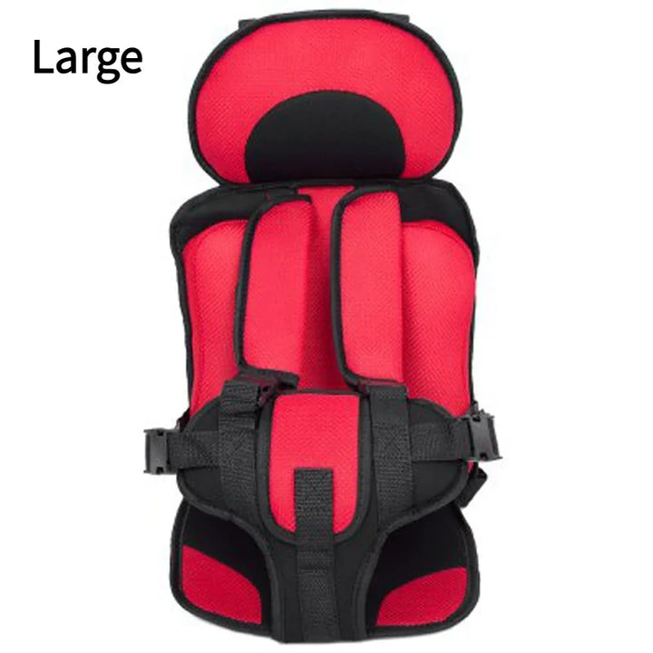 Large red and black padded child safety car seat with adjustable straps and harness