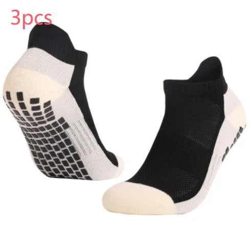 Pair of black and white no-show athletic socks with non-slip grips on soles, 3-piece set