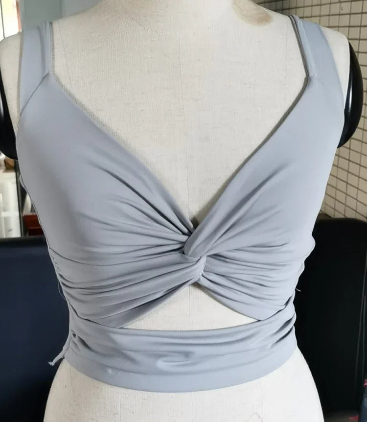 Light grey twisted front crop top with spaghetti straps displayed on mannequin
