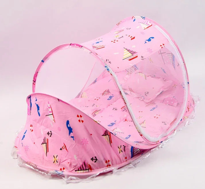 Pink baby mosquito net tent with nautical sailboat and anchor prints, transparent mesh sides