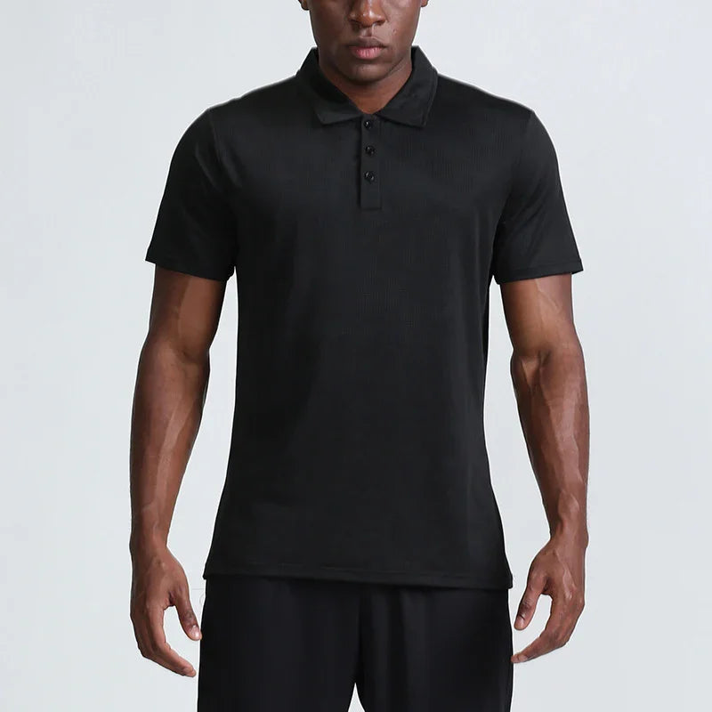 Man wearing black short sleeve polo shirt with three-button placket, plain background