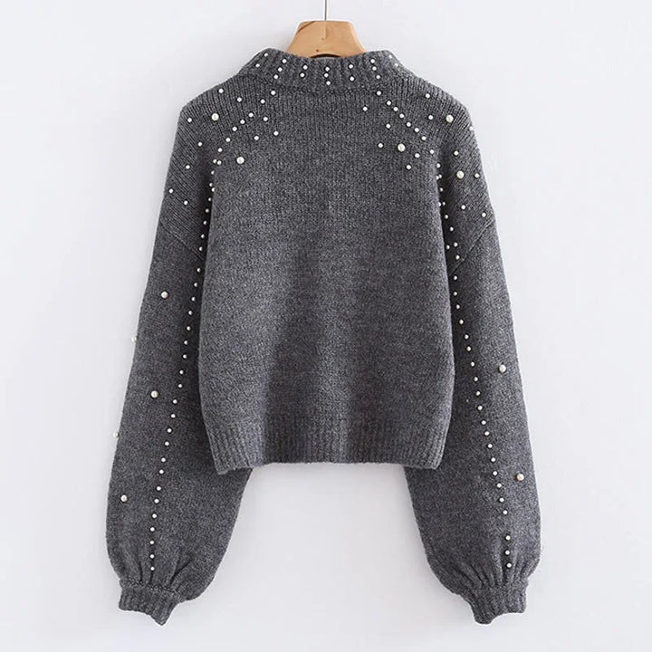 Gray knitted sweater with pearl embellishments on sleeves and shoulders, ribbed cuffs and hem
