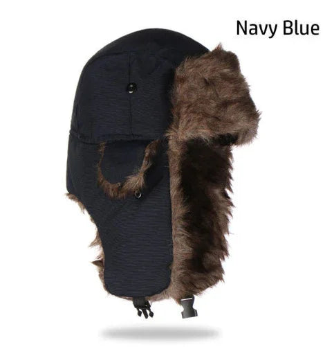 Navy blue winter trapper hat with brown faux fur lining and ear flaps, front buckle closure