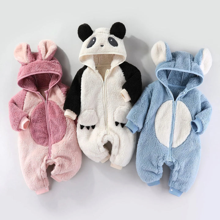 Three plush baby animal onesies in pink bunny, panda, and blue bear designs with hoods and ears