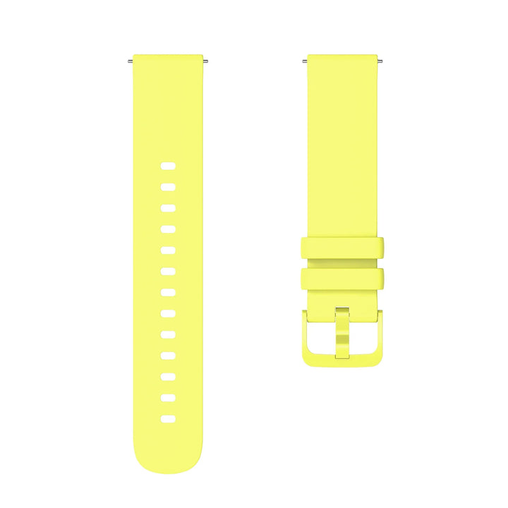 Bright yellow silicone watch strap with buckle and adjustment holes on white background