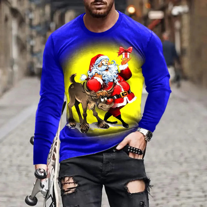 Man wearing blue Christmas sweater with Santa Claus and reindeer holding gift design, standing on cobblestone street
