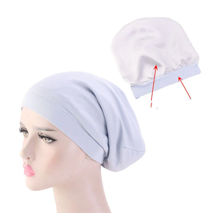 Light blue stretchy cotton chemo beanie cap on mannequin and flat view showing elastic band