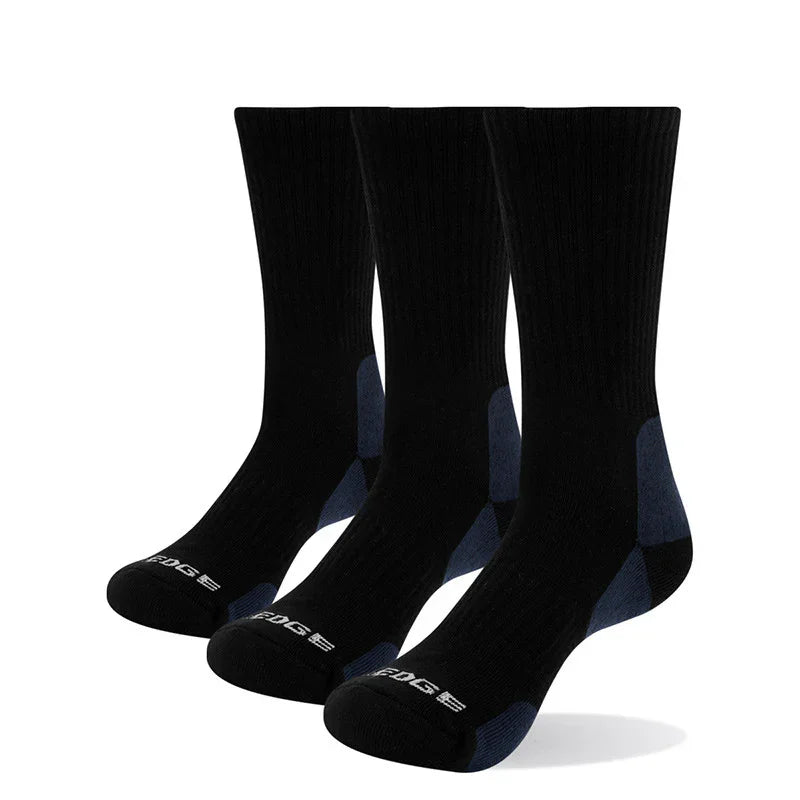 Three pairs of black crew socks with dark blue heels and toes, featuring cushioned soles and ribbed cuffs