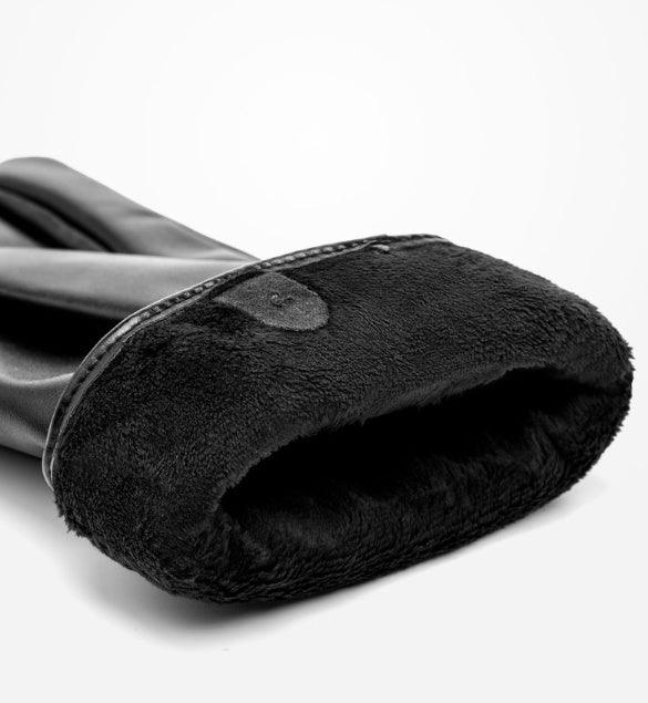 Close-up of black leather glove with soft, plush fleece lining on white background