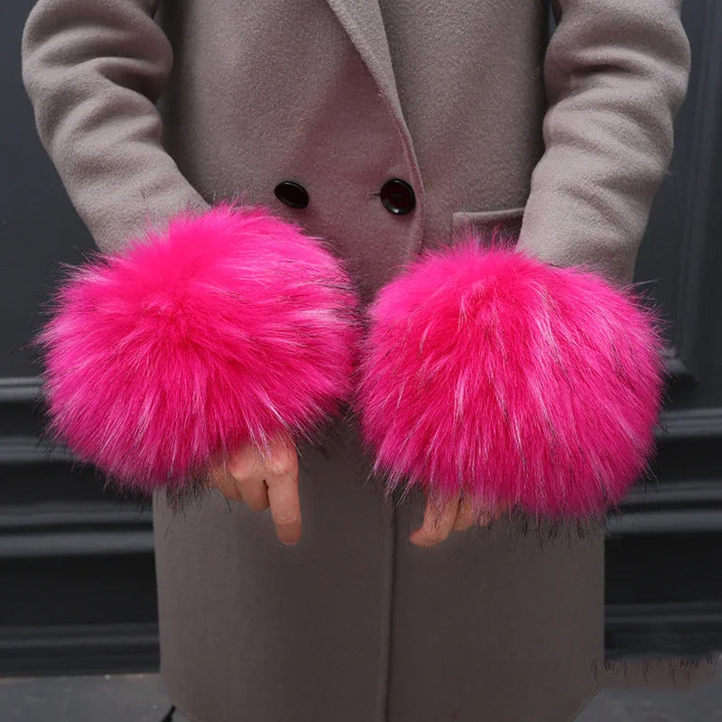 Person wearing beige coat with bright pink fluffy faux fur cuffs on sleeves