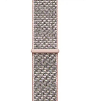 Close-up of light pink woven fabric watch band with adjustable loop on white background