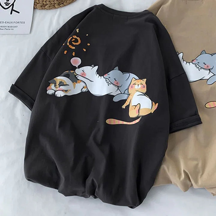 Black t-shirt featuring a cartoon design of four relaxed cats in various poses