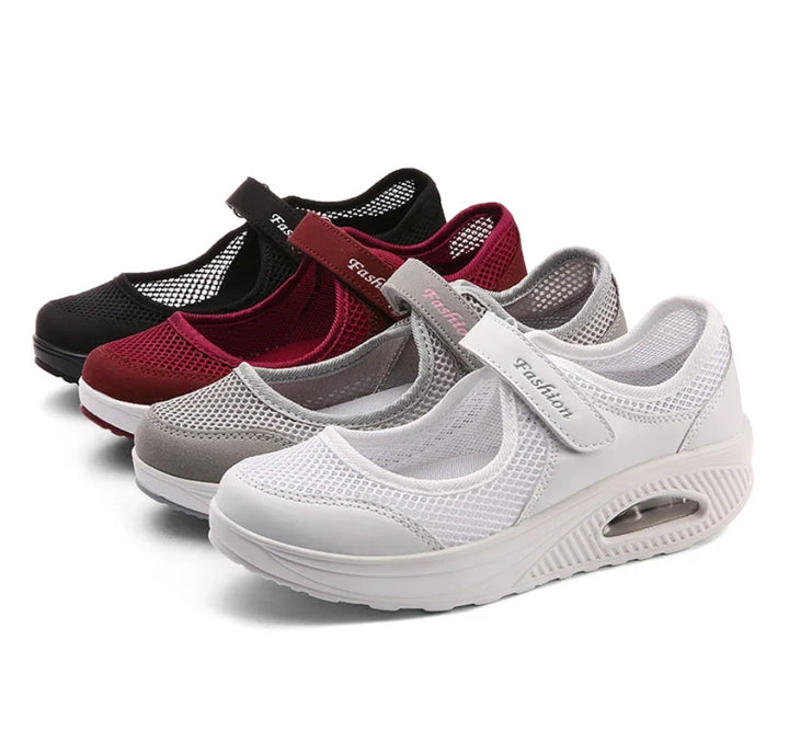 Four pairs of breathable mesh Mary Jane sneakers in black, burgundy, gray, and white with velcro straps