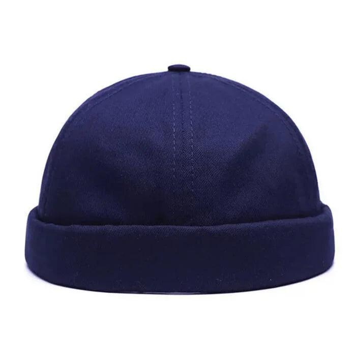 Dark navy blue docker beanie hat with folded cuff and stitched panels
