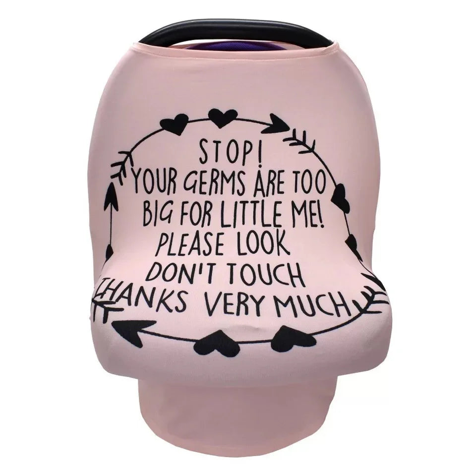 Pink baby car seat cover with black heart and arrow design and text warning germs are too big, please don't touch