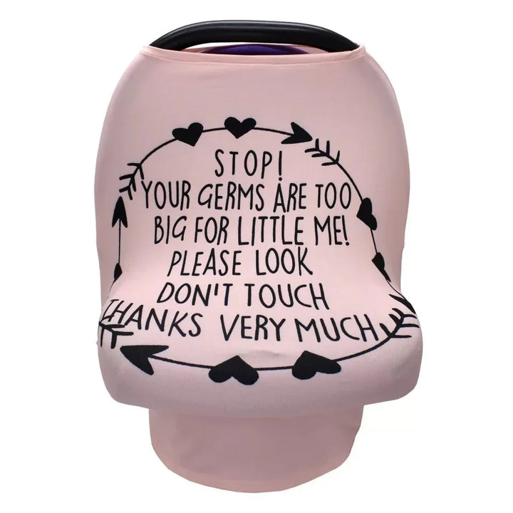 Pink baby car seat cover with black heart and arrow design and text warning germs are too big, please don't touch