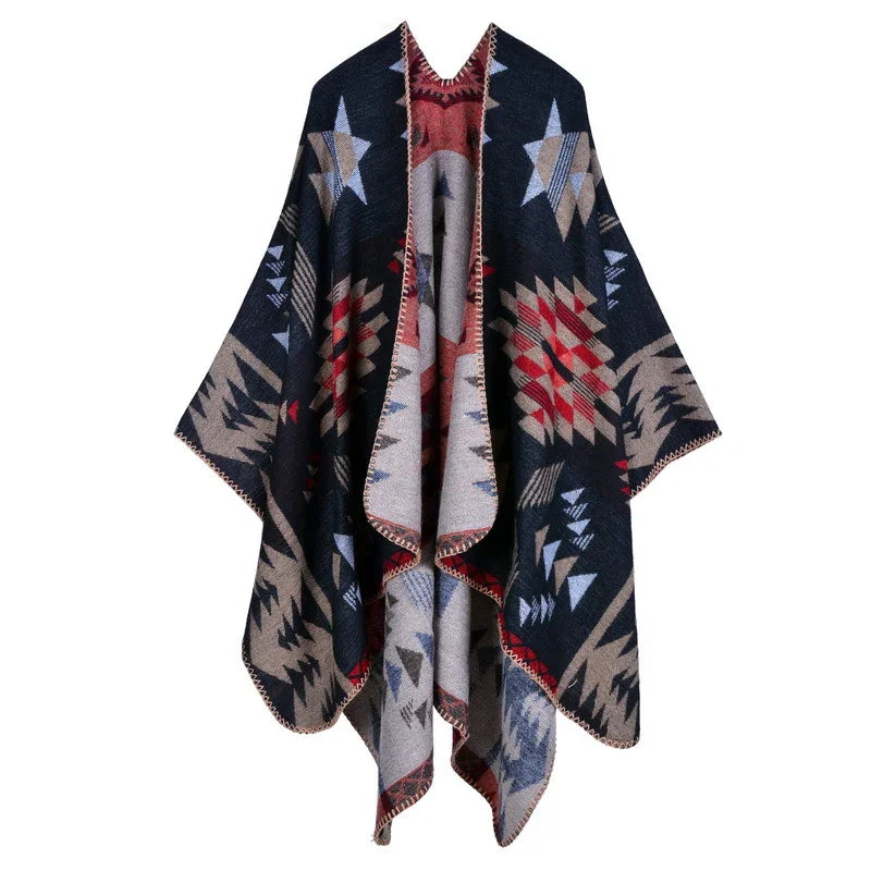 Bohemian style geometric print poncho with navy, beige, red, and light blue patterns