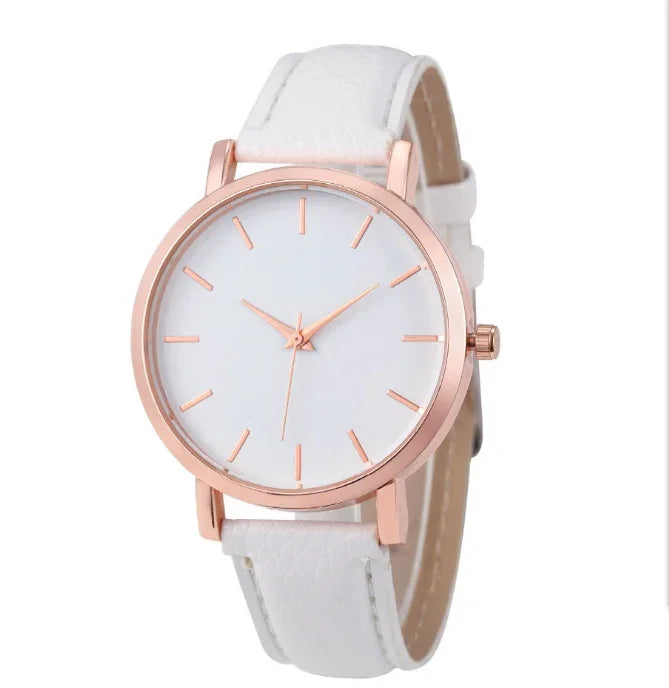 Minimalist white wristwatch with rose gold case and markers, white leather strap, round dial