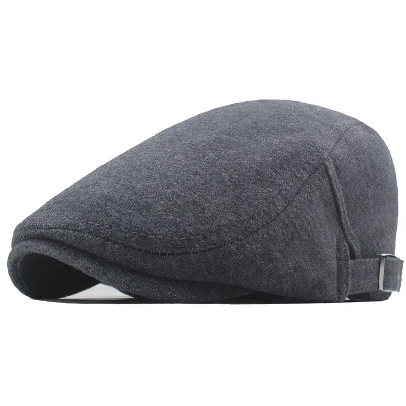 Dark gray wool flat cap with adjustable strap on white background