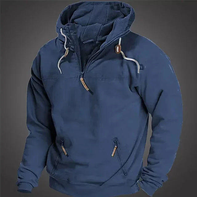 Men's navy blue pullover hoodie with drawstrings and front zip pockets on gray background