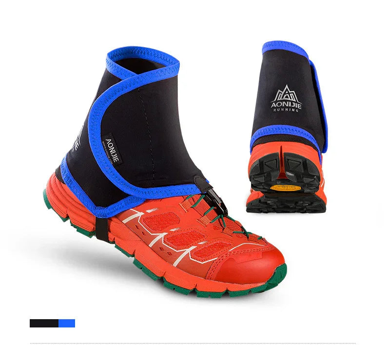 Red trail running shoes with black and blue Aonijie running gaiters on white background