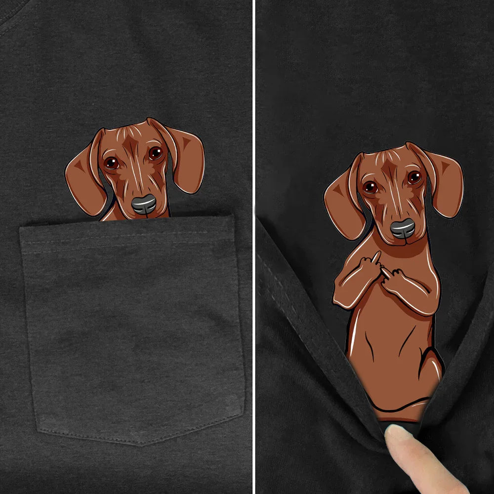 Black shirt pocket with a cartoon dachshund dog peeking out and showing middle fingers underneath