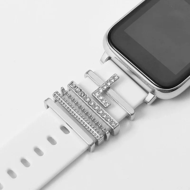 White smartwatch with silver and rhinestone decorative metal charms on the strap