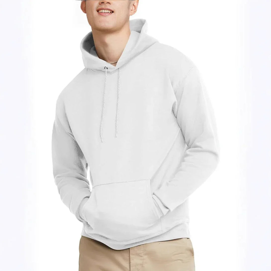 smiling man wearing plain white hoodie with front pocket and beige pants on white background