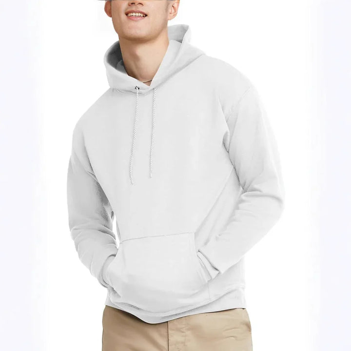 smiling man wearing plain white hoodie with front pocket and beige pants on white background