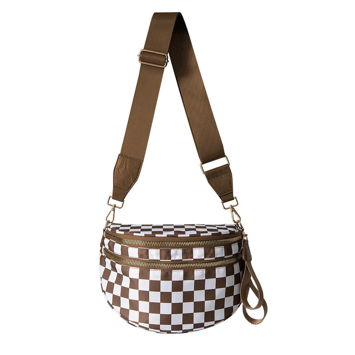 Brown and white checkered crossbody bag with wide adjustable strap and gold zippers